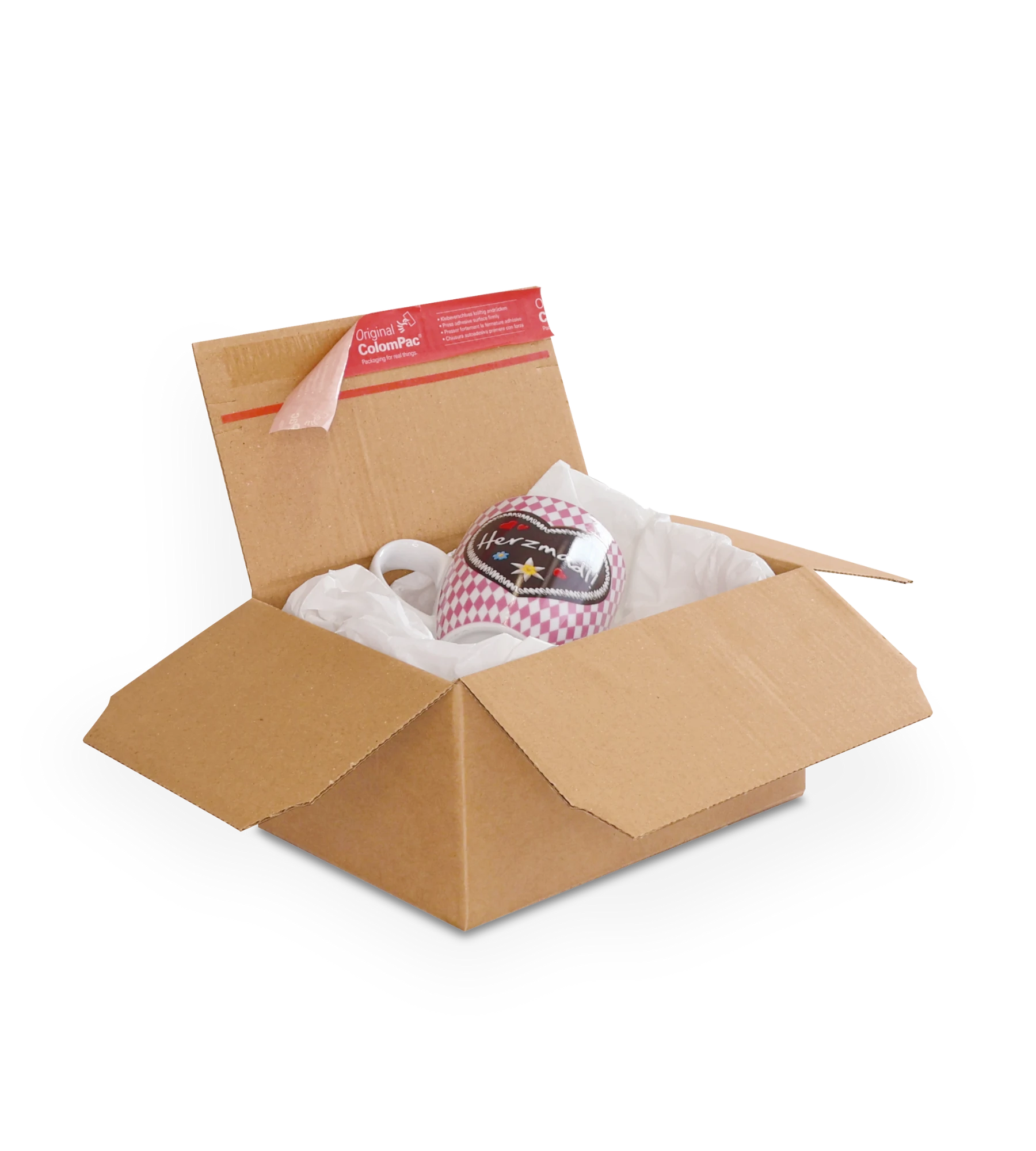 Geöffneter brauner Versandkarton aus Wellpappe mit weißem Seidenpapier und einer rot-weiß karierten Mütze  und einem Sternsymbol. Auf der oberen Klappe ein roter ColomPac-Selbstklebeverschluss.