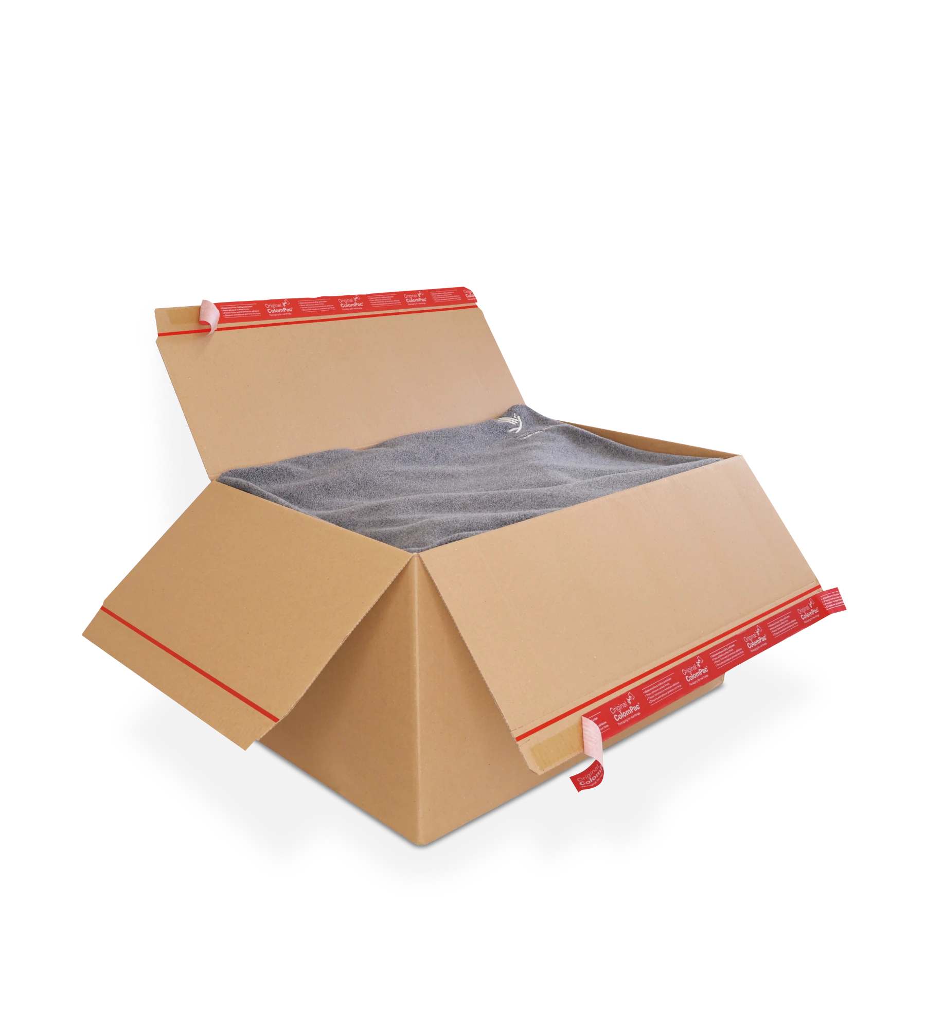 Geöffneter Versandkarton aus Wellpappe mit roten ColomPac-Selbstklebeverschluss auf den Deckelklappen enthält eine graue Wolldecke.